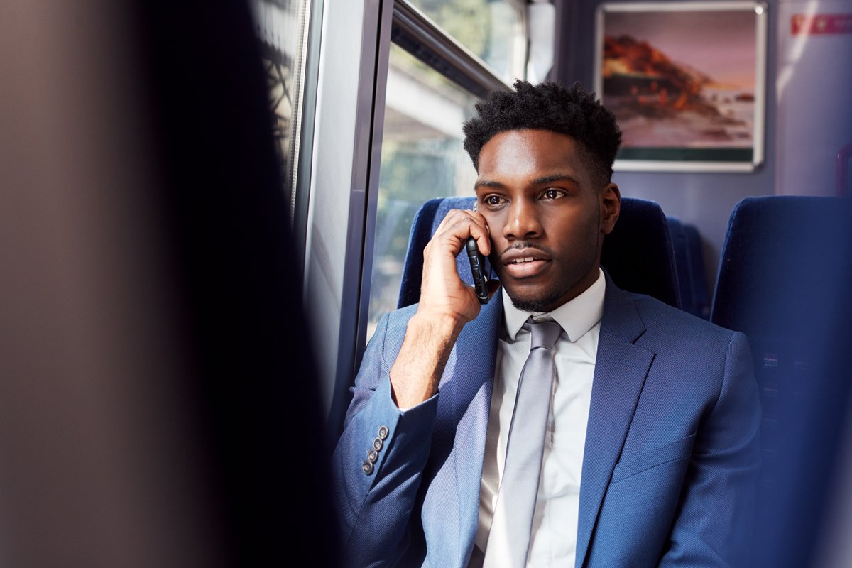 professional-man-talking-on-phone-while-riding